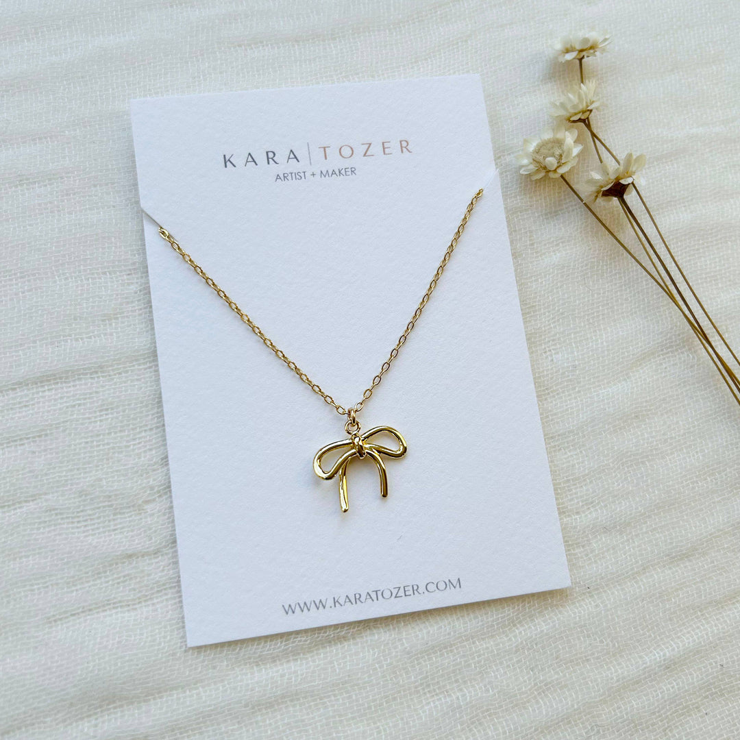 Gold Bow Charm Necklace